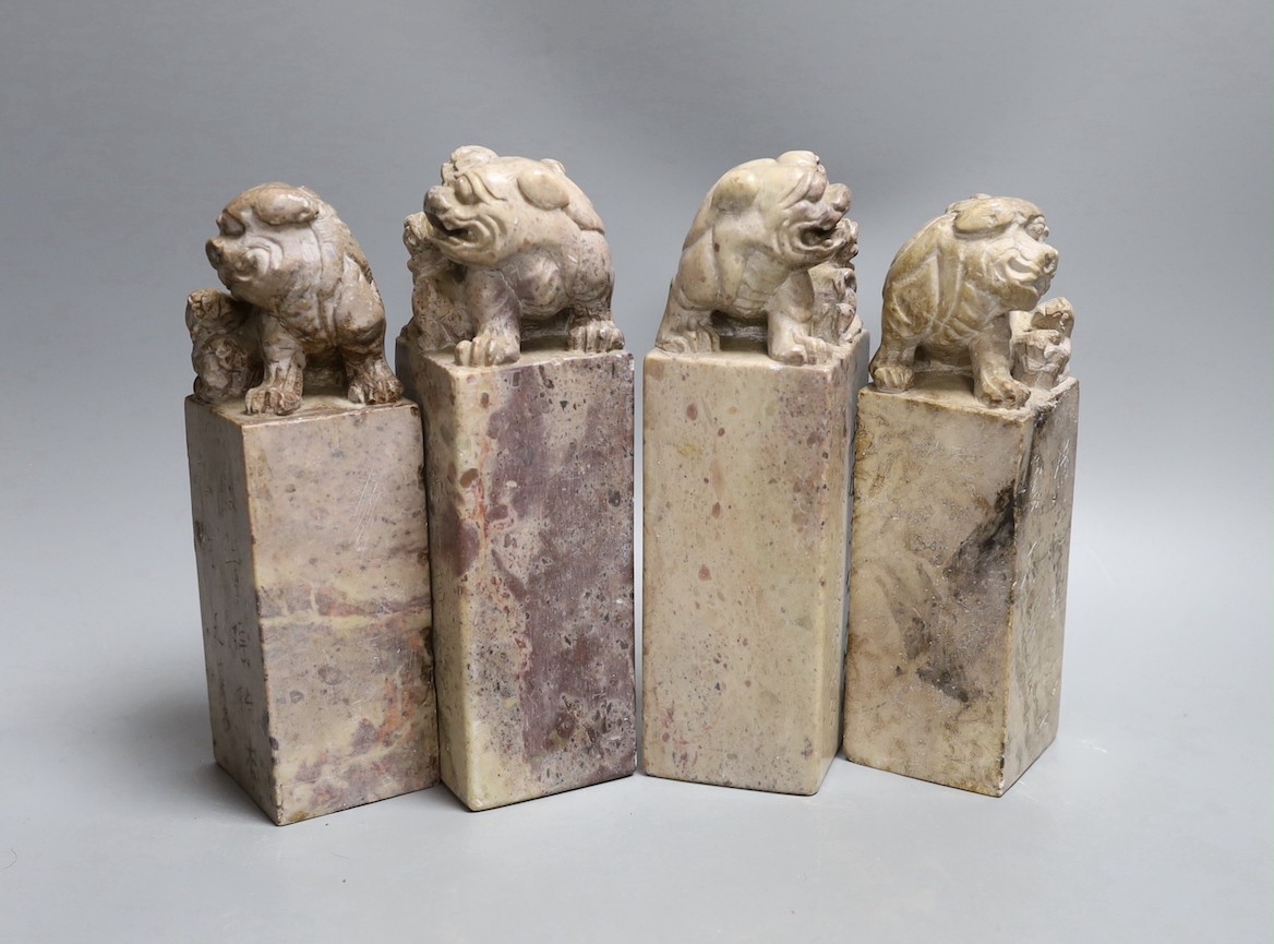 Two pairs of Chinese carved soapstone ‘lion dog’ seals and similar cups, tallest 19cm